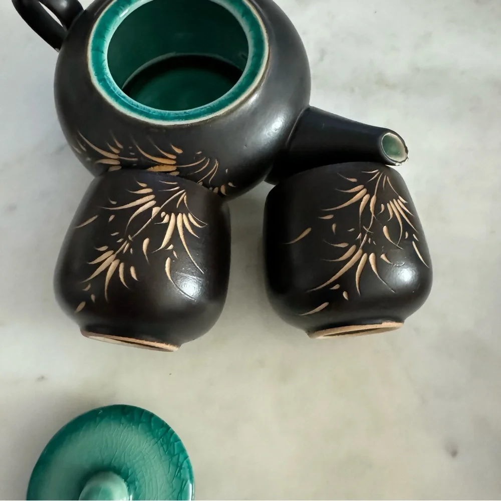 Carved Vietnamese tea kettle set with 2 small tea cups
